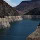 A bleached ‘bathtub ring’ is visible on the banks of Lake Mead near the Hoover Dam on August 19, 2022 in Lake Mead National Recreation Area, Arizona.